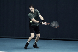 UK tennis player Andy Murray. In action playing tennis, wearing Andy Murray Castore AMC tennis clothing, including arm sweatbands and cap. shot at National Tennis centre in London Ross Woodhall - Action & Lifestyle Photography