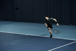 UK tennis player Andy Murray. In action after taking a serve, wearing Andy Murray Castore AMC tennis clothing, including arm sweatbands. shot at National Tennis centre in London Ross Woodhall - Action & Lifestyle Photography