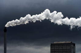 Factory chimney with bright white smoke emitting from it carried off by the breeze. Ross Woodhall - Action & Lifestyle Photography