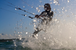 Kite surfer in the water, with splash of water. Ross Woodhall - Action & Lifestyle Photography