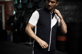 Man at gym wearing Castore gilet. sports workout wear. Ross Woodhall - Action & Lifestyle Photography