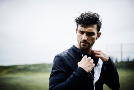 Man in the rain wearing Castore branded clothing. Ross Woodhall - Action & Lifestyle Photography