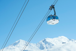 Val d Isere telecabine above the mountains. Ross Woodhall - Action & Lifestyle Photography