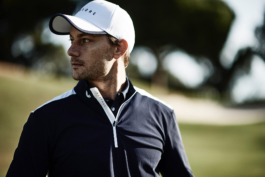 Man wearing a cap & Castore golf clothing close up. Ross Woodhall - Action & Lifestyle Photography