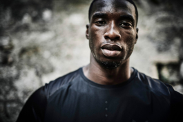 male athlete. looking at the camera. wearing a black top. Ross Woodhall - Action & Lifestyle Photography