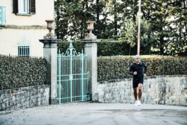 male runner, jogging along a road, outside. European. Ross Woodhall - Action & Lifestyle Photography