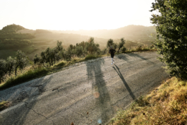 male runner, jogging along an old tarmac road on a misty morning. Ross Woodhall - Action & Lifestyle Photography