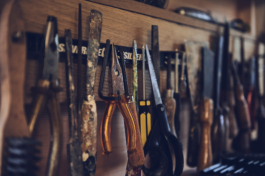 Set of different tools hung up along a magnetic strip. Ross Woodhall - Action & Lifestyle Photography