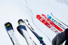 four pairs of different skis from a chairlift. Ross Woodhall - Action & Lifestyle Photography