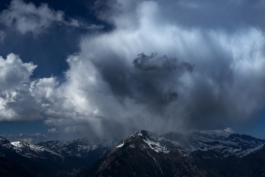 Mountains in clouds with a dusting of snow. Ross Woodhall - Action & Lifestyle Photography