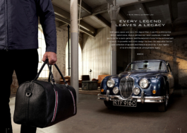 Lifestyle collection shoot with a man carrying a branded Jaguar weekend bag walking away from an old Jaguar Mark 2 parked in a garage. With added text from advertising campaign. Ross Woodhall - Action & Lifestyle Photography