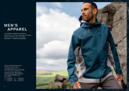 Advertising campaign of a Man wearing 2 coloured light weight hooded jacket in grey & blue, looking out into the distance with a rocky background opening up to fields. Details of the men's apparel on the left hand side of the image. Ross Woodhall - Action & Lifestyle Photography