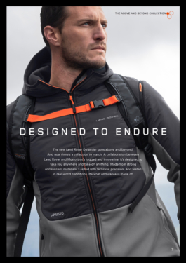 Man wearing light grey 2 tone coloured light weight raincoat with a backpack on. With advertising details of the jacket from Land Rover, Musto brands. Ross Woodhall - Action & Lifestyle Photography