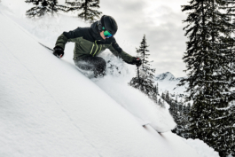 male skier skiing off piste between the trees. Ross Woodhall - Action & Lifestyle Photography