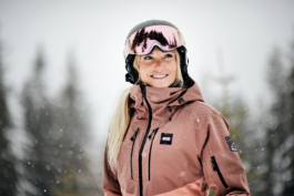 female skier with ski gear and goggles on in the snow. Ross Woodhall - Action & Lifestyle Photography