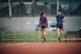 two athletes chatting on the track Ross Woodhall - Action & Lifestyle Photography