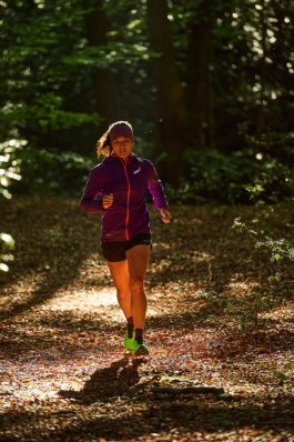 woman jogger on a woodland jog Ross Woodhall - Action & Lifestyle Photography