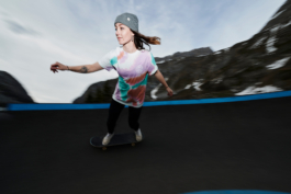 woman on a skateboard on a skateboard track in the mountains. Ross Woodhall - Action & Lifestyle Photography