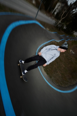 man on skateboard on a skateboard track Ross Woodhall - Action & Lifestyle Photography