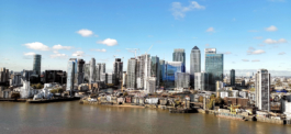 view of London city across the river Thames with some old buildings with high rise buildings in background. Ross Woodhall - Action & Lifestyle Photography