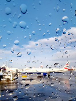 Picture of British Airways aeroplane taken through a window with water droplets. Ross Woodhall - Action & Lifestyle Photography