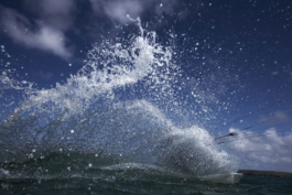 Kite surfer covered with a big splash of water. Ross Woodhall - Action & Lifestyle Photography