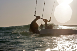 Kite surfer setting off in the sea, taken from the water. Ross Woodhall - Action & Lifestyle Photography