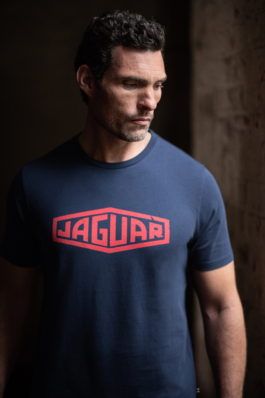 Man wearing a Jaguar branded navy T shirt with red writing. Ross Woodhall - Action & Lifestyle Photography