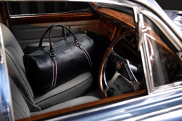 View into a Mark 2 Jaguar through the open window looking at a branded weekend bag Ross Woodhall - Action & Lifestyle Photography
