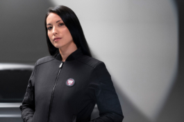 Woman wearing a light weight jacket from the Jaguar branded clothing line. Ross Woodhall - Action & Lifestyle Photography