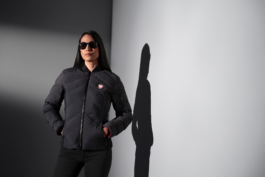 Woman wearing a branded quilted jacket from Jaguar. Flashlight used, woman wearing sunglasses. Ross Woodhall - Action & Lifestyle Photography