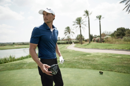 Man playing golf on the green wearing Castore clothing. Ross Woodhall - Action & Lifestyle Photography