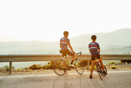 two cyclist taking a pause and looking at the view. Ross Woodhall - Action & Lifestyle Photography