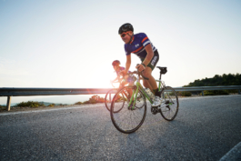 two road cyclists, cycling a long an open road. Ross Woodhall - Action & Lifestyle Photography
