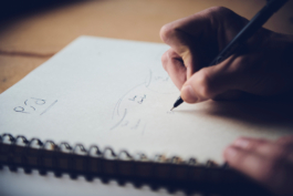 Close up of a Man working on his ski design in a notebook. Ross Woodhall - Action & Lifestyle Photography