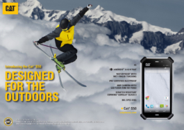 Advertisement for Cat mobile phone with skier mid air. Wearing yellow and grey jacket which fits with yellow logo. Ross Woodhall - Action & Lifestyle Photography