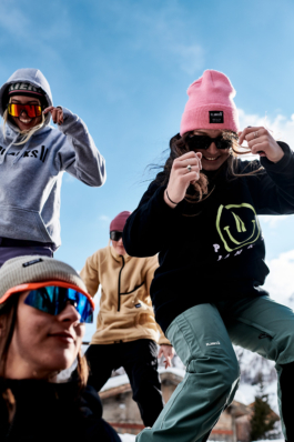 Four skiers being playful in their poes towards the camera. Ross Woodhall - Action & Lifestyle Photography