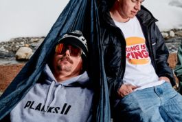 Two men relaxing, one in a hammock. wearing sunglasses and a wooly hat. Ross Woodhall - Action & Lifestyle Photography