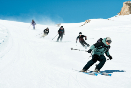 Five skiers zigzagging their way down the piste. Ross Woodhall - Action & Lifestyle Photography
