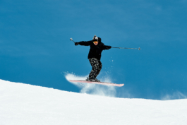 Skier in the air with a half twist. Ross Woodhall - Action & Lifestyle Photography