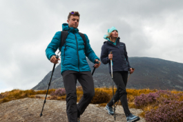 Couple hiking with walking poles. wearing hiking clothing. Ross Woodhall - Action & Lifestyle Photography