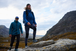 Couple out hiking with full kit surrounded by autumnal colours. Ross Woodhall - Action & Lifestyle Photography