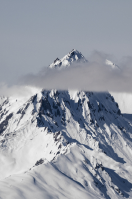 Mountain in La Plagne through a cloud covered in snow Ross Woodhall - Action & Lifestyle Photography